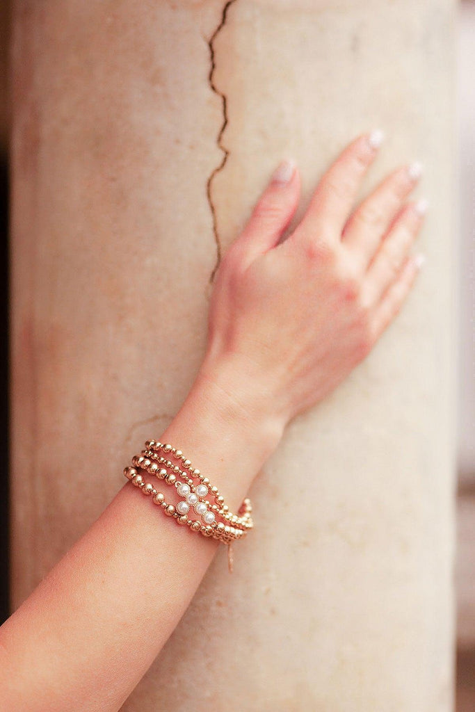 Elisha Pearl Cross Stretch Bracelet in Worn Gold - Canvas Style