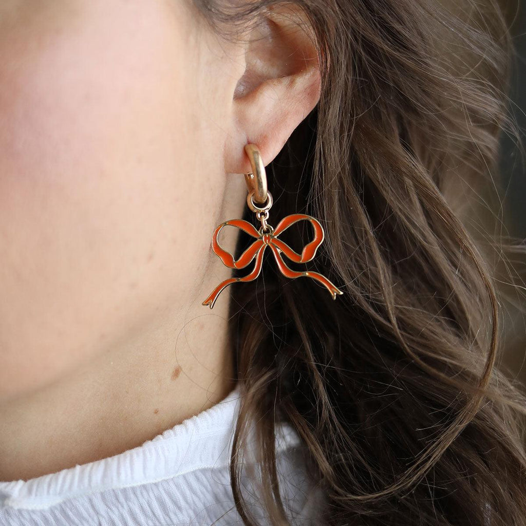 Veronica Game Day Bow Enamel Earrings in Orange - Canvas Style